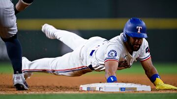 Aug 15, 2024; Arlington, Texas, USA; Texas Rangers center fielder Leody Taveras (3) dives back to first base to avoid the tag during the game against the Minnesota Twins at Globe Life Field. Mandatory Credit: Jerome Miron-USA TODAY Sports