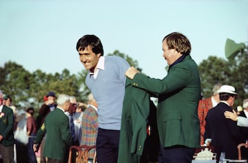 APRIL 1983: Seve Ballesteros of Spain is helped into the green jacket by Craig Stadler of the USA after winning the US Masters