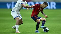 Cyprus' defender #12 Charalambos Kyriakou fights for the ball with Spain's defender #02 Alex Grimaldo during the UEFA Euro 2024 Group A qualifying football match between Cyprus and Spain at the Alphamega Stadium in Limassol on November 16, 2023. (Photo by Jewel SAMAD / AFP)