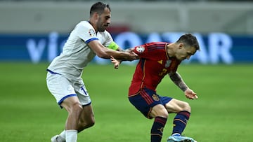 Cyprus' defender #12 Charalambos Kyriakou fights for the ball with Spain's defender #02 Alex Grimaldo during the UEFA Euro 2024 Group A qualifying football match between Cyprus and Spain at the Alphamega Stadium in Limassol on November 16, 2023. (Photo by Jewel SAMAD / AFP)