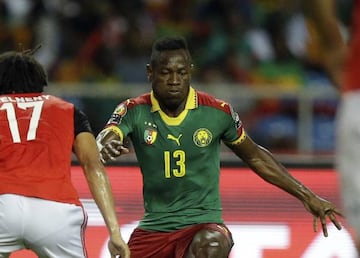 FILE - In this Sunday, Feb. 5, 2017 filer, Cameroon's Christian Bassogog challenges Egypt's Mohamed Elneny, left, during the African Cup of Nations final soccer match between Egypt and Cameroon at the Stade de l'Amitie, in Libreville, Gabon