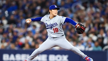 TORONTO, CANADA - APRIL 7: Yoshinobu Yamamoto #18 of the Los Angeles Dodgers pitches in the first inning of their MLB against the Toronto Blue Jays at Rogers Centre on April 7, 2026 in Toronto, Ontario, Canada. Cole Burston/Getty Images/AFP (Photo by Cole Burston / GETTY IMAGES NORTH AMERICA / Getty Images via AFP)