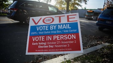 A sign urging people to vote is seen in Washington, DC, on November 3, 2020 during the US general election. - The United States started voting Tuesday in an election amounting to a referendum on Donald Trump's uniquely brash and bruising presidency,