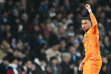 Real Madrid's French forward #09 Kylian Mbappe celebrates after scoring his team first goal during the UEFA Champions League football match between Manchester City and Real Madrid at the Etihad Stadium in Manchester, north west England, on February 11, 2025. (Photo by Paul ELLIS / AFP)