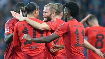 Bayern Munich's German forward #10 Leroy Sane celebrates scoring the 0-4 goal with his teammates during the German first division Bundesliga football match between VfL Bochum and FC Bayern Munich in Bochum, western Germany, on October 27, 2024. (Photo by INA FASSBENDER / AFP) / DFL REGULATIONS PROHIBIT ANY USE OF PHOTOGRAPHS AS IMAGE SEQUENCES AND/OR QUASI-VIDEO