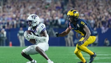 TCU Horned Frogs wide receiver Derius Davis (11) makes a catch in front of Michigan Wolverines defensive back DJ Turner (5)