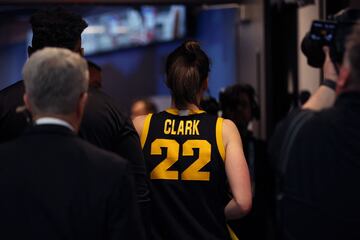 Caitlin Clark #22 of the Iowa Hawkeyes leaves after speaking to the media after losing to the South Carolina Gamecocks 