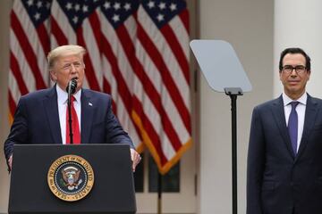 U.S. President Donald Trump is accompanied by Treasury Secretary Steven Mnuchin as he makes an announcement about U.S. trade relations with China and Hong Kong.