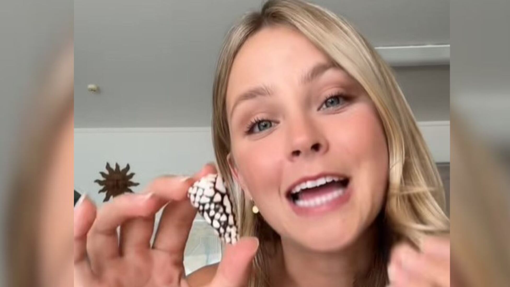 She finds a beautiful shell on the beach and immediately realizes that ...