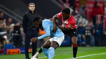 Celta Vigo's Ivorian midfielder #17 Jonathan Bamba (L) is challenged by Athletic Bilbao's Spanish forward #09 Inaki Williams during the Spanish league football match between Athletic Club Bilbao and RC Celta de Vigo at the San Mames stadium in Bilbao on November 10, 2023. (Photo by ANDER GILLENEA / AFP)