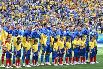 Ukraine's players line up prior to the UEFA Euro 2024 Group E football match between Romania and Ukraine at the Munich Football Arena in Munich on June 17, 2024. (Photo by MIGUEL MEDINA / AFP)