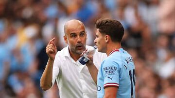MANCHESTER, ENGLAND - AUGUST 27: Pep Guardiola, Manager of Manchester City interacts with Julian Alvarez of Manchester City during the Premier League match between Manchester City and Crystal Palace at Etihad Stadium on August 27, 2022 in Manchester, England. (Photo by Manchester City FC/Manchester City FC via Getty Images)