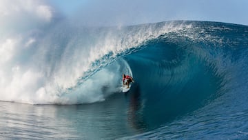 Kelly Slater of Cocoa Beach, Florida, USA (pictured) rides an enormous barrel at Teahupo'o during Round 1 of the Billabong Pro Tahiti on Monday August 18, 2014. Slater posted a near perfect 9.40 ride (out of a possible ten) and has advanced into Round 3.