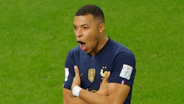 TOPSHOT - France's forward #10 Kylian Mbappe celebrates scoring his team's third goal during the Qatar 2022 World Cup round of 16 football match between France and Poland at the Al-Thumama Stadium in Doha on December 4, 2022. (Photo by Odd ANDERSEN / AFP) (Photo by ODD ANDERSEN/AFP via Getty Images)