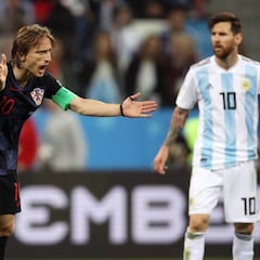 What awards and trophies have Lionel Messi and Luka Modric won?