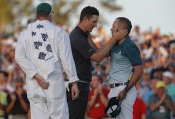 Justin Rose congratulates Sergio Garcia.