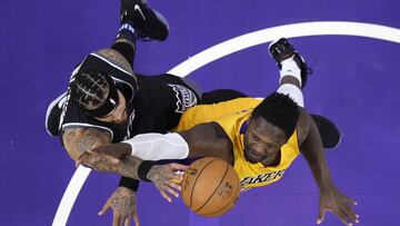 Sacramento Kings center Willie Cauley-Stein, left, shoots as Los Angeles Lakers forward Julius Randle defends during the first half of an NBA basketball game, Friday, April 7, 2017, in Los Angeles. (AP Photo/Mark J. Terrill)