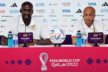 Ghana's coach Otto Addo (L) and player Andre Ayew