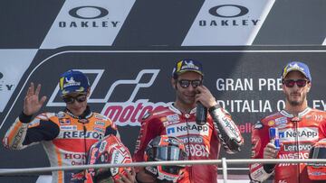 SCARPERIA, ITALY - JUNE 02: (L-R) Marc Marquez of Spain and Repsol Honda Team , Danilo Petrucci of Italy and Ducati Team and Andrea Dovizioso of Italy and Ducati Team celebrate on the podium at the end of the MotoGP race during the MotoGp of Italy - Race at Mugello Circuit on June 02, 2019 in Scarperia, Italy. (Photo by Mirco Lazzari gp/Getty Images)