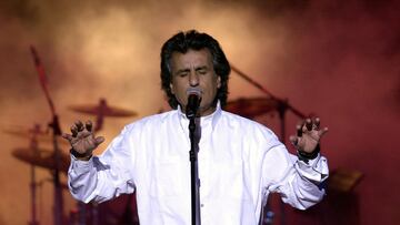 (FILES) Italian singer and composer Toto Cutugno performs late on July 26, 2002 at the Roman theater outside Tunis during the 38th international festival of Cartagena. Toto Cutugno, famous in Italy and abroad for his hit "Un Italiano vero" and his Eurovision victory in 1990 with "Insieme: 1992", died at the age of 80 on August 22, 2023 in Milan according to the Italian agency Ansa. (Photo by Fethi Belaid / AFP)