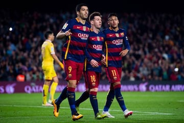 Luis Suarez (L) of FC Barcelona celebrates with his teammates Lionel Messi (C) and Neymar Santos Jr (R)