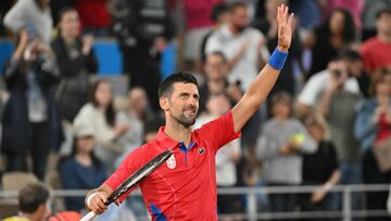 Serbia's Novak Djokovic reacts after his win over Australia's Matthew Ebden in their men's singles first round tennis match on Court Philippe-Chatrier at the Roland-Garros Stadium at the Paris 2024 Olympic Games, in Paris on July 27, 2024. (Photo by Miguel MEDINA / AFP)
