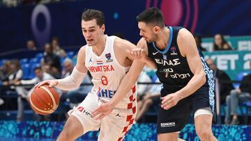Mario Hezonja (L) goes for a basket against Kostas Papanikolaou during the FIBA EuroBasket 2022 group C stage match between Croatia and Greece at Assago Forum, near Milan, Italy, 02 September 2022.