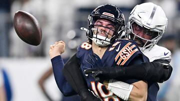 MINNEAPOLIS, MINNESOTA - DECEMBER 16: Jonathan Greenard #58 of the Minnesota Vikings strip sacks Caleb Williams #18 of the Chicago Bears during the first quarter at U.S. Bank Stadium on December 16, 2024 in Minneapolis, Minnesota. Minnesota recovered the ball on the play. Stephen Maturen/Getty Images/AFP (Photo by Stephen Maturen / GETTY IMAGES NORTH AMERICA / Getty Images via AFP)