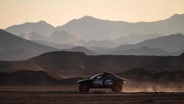 Team Audi Sport's Swedish driver Mattias Ekstrom and Swedish co-driver Emil Bergkvist steer their car outside the camp in Al-Ula, Saudi Arabia, on January 4, 2024, on the eve of the start of the Dakar rally 2024. (Photo by PATRICK HERTZOG / AFP)