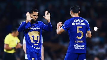 Soccer Football - Liga MX - Pumas UNAM v Cruz Azul - Estadio Olimpico Universitario, Mexico City, Mexico - March 14, 2026 Pumas UNAM's Juninho Vieira celebrates scoring their first goal from the penalty spot with Ruben Duarte REUTERS/Eloisa Sanchez