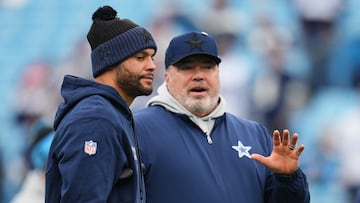 CHARLOTTE, NORTH CAROLINA - DECEMBER 15: Dak Prescott #4 and head coach Mike McCarthy of the Dallas Cowboys talk before the game against the Carolina Panthers at Bank of America Stadium on December 15, 2024 in Charlotte, North Carolina. Grant Halverson/Getty Images/AFP (Photo by GRANT HALVERSON / GETTY IMAGES NORTH AMERICA / Getty Images via AFP)