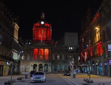 Liverpool Town Hall lit up by red light in rememberance of the 96.