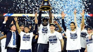 Apr 4, 2016; Houston, TX, USA; Villanova Wildcats forward Daniel Ochefu hoists the national championship trophy with teammates after defeating the North Carolina Tar Heels in the championship game of the 2016 NCAA Men's Final Four at NRG Stadium.