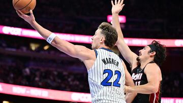 ORLANDO, FLORIDA - OCTOBER 22: Franz Wagner #22 of the Orlando Magic shoots a basket against Jaime Jaquez Jr. #11 of the Miami Heat in the second half of the game at Kia Center on October 22, 2025 in Orlando, Florida. NOTE TO USER: User expressly acknowledges and agrees that, by downloading and or using this photograph, User is consenting to the terms and conditions of the Getty Images License Agreement. Julio Aguilar/Getty Images/AFP (Photo by Julio Aguilar / GETTY IMAGES NORTH AMERICA / Getty Images via AFP)