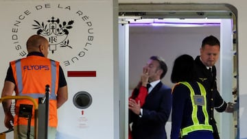 France's President Emmanuel Macron was pushed in the face by his wife Brigitte Macron as the couple arrived in Vietnam to begin a tour of Southeast Asia, at Noi Bai International Airport, in Hanoi, Vietnam, May 25, 2025. REUTERS/Chalinee Thirasupa