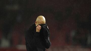 Manchester City's head coach Pep Guardiola reacts after the English Premier League soccer match between Manchester United and Manchester City at Old Trafford in Manchester, England, Sunday, March 8, 2020. (AP Photo/Dave Thompson)