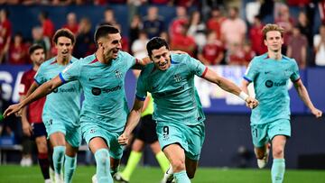 Barcelona's Spanish forward #07 Ferran Torres celebrates Barcelona's Polish forward #09 Robert Lewandowski's goal scored from the penalty spot during the Spanish Liga football match between CA Osasuna and FC Barcelona at El Sadar stadium in Pamplona on September 3, 2023. (Photo by ANDER GILLENEA / AFP)