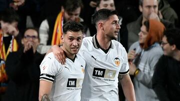 Valencia's Ukrainian forward #17 Roman Yaremchuk celebrates with Valencia's Spanish forward #09 Hugo Duro scoring his team's second goal during the Spanish league football match between Valencia CF and Real Madrid at the Mestalla stadium in Valencia on March 2, 2024 (Photo by Jose Jordan / AFP)