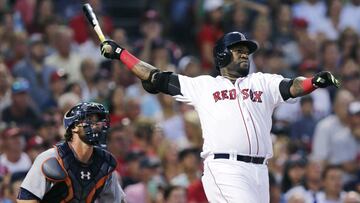 FILE - Boston Red Sox designated hitter David Ortiz, right, and Detroit Tigers catcher Jarrod Saltalamacchia watch the flight of Ortiz&#039;s three-run home run during the third inning of a baseball game July 26, 2016, at Fenway Park in Boston. Ortiz was 