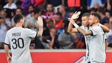 Paris Saint-Germain's French forward Kylian Mbappe (2ndR) celebrates with Paris Saint-Germain's Brazilian forward Neymar (R) and Paris Saint-Germain's Argentinian forward Lionel Messi after scoring his team's seventh goal during the French L1 football match between Lille OSC and Paris-Saint Germain (PSG) at Stade Pierre-Mauroy in Villeneuve-d'Asq, northern France on August 21, 2022. (Photo by DENIS CHARLET / AFP)