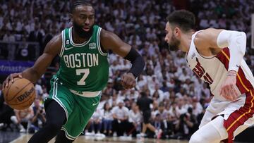 Jaylen Brown #7 of the Boston Celtics controls the ball ahead of Max Strus #31 of the Miami Heat