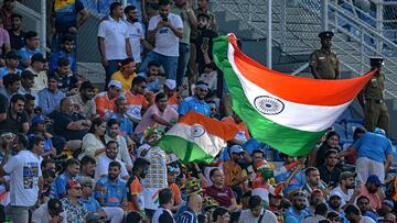 Fans wave India's national flags during the Asia Cup 2023 one-day international (ODI) cricket match between India and Pakistan at the Pallekele International Cricket Stadium in Kandy on September 2, 2023. (Photo by Ishara S. KODIKARA / AFP)