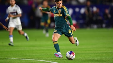 Mar 18, 2023; Carson, California, USA; Los Angeles Galaxy midfielder Riqui Puig (6) takes a shot on goal against the Vancouver Whitecaps during the second half at Dignity Health Sports Park. Mandatory Credit: Gary A. Vasquez-USA TODAY Sports