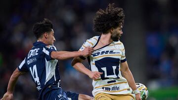 Erick Aguirre (L) of Monterrey fights for the ball with Cesar Huerta (R) of Pumas during the Quarter final first leg round match between Monterrey and Pumas UNAM as part of the Liga BBVA MX, Torneo Apertura 2024 at BBVA Bancomer Stadium on November 28, 2024 in Monterrey, Nuevo Leon, Mexico.