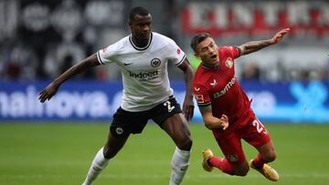 FRANKFURT AM MAIN, GERMANY - OCTOBER 15: Charles Aranguiz of Leverkusen is challenged by Evan N'Dicka of Eintracht Frankfurt  during the Bundesliga match between Eintracht Frankfurt and Bayer 04 Leverkusen at Deutsche Bank Park on October 15, 2022 in Frankfurt am Main, Germany. (Photo by Alex Grimm/Getty Images)