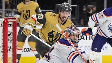 LAS VEGAS, NEVADA - MARCH 28: Stuart Skinner #74 of the Edmonton Oilers and Chandler Stephenson #20 of the Vegas Golden Knights watch a Golden Knights' shot ricochet off of a goal post in the second period of their game at T-Mobile Arena on March 28, 2023 in Las Vegas, Nevada. Ethan Miller/Getty Images/AFP (Photo by Ethan Miller / GETTY IMAGES NORTH AMERICA / Getty Images via AFP)