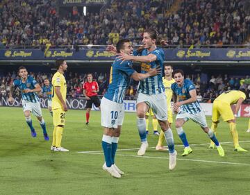 Los jugadores rojiblancos Correa y Filipe Luis celebran el 0-1 del brasileño. 