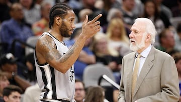Mar 19, 2017; San Antonio, TX, USA; San Antonio Spurs small forward Kawhi Leonard (2) talks with head coach Gregg Popovich during the second half against the Sacramento Kings at AT&T Center. Mandatory Credit: Soobum Im-USA TODAY Sports