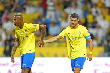 Nassr's Portuguese forward Cristiano Ronaldo walks with Nassr's Brazilian forward Talisca 