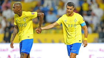 Nassr's Portuguese forward Cristiano Ronaldo walks with Nassr's Brazilian forward Talisca (L) during the 2023 Arab Club Champions Cup semi-final football match between Saudi Arabia's Al-Nassr and Iraq's Al-Shorta at Prince Sultan bin Abdul Aziz Stadium in Abha on August 9, 2023. (Photo by Abdullah Mahdi / AFP)